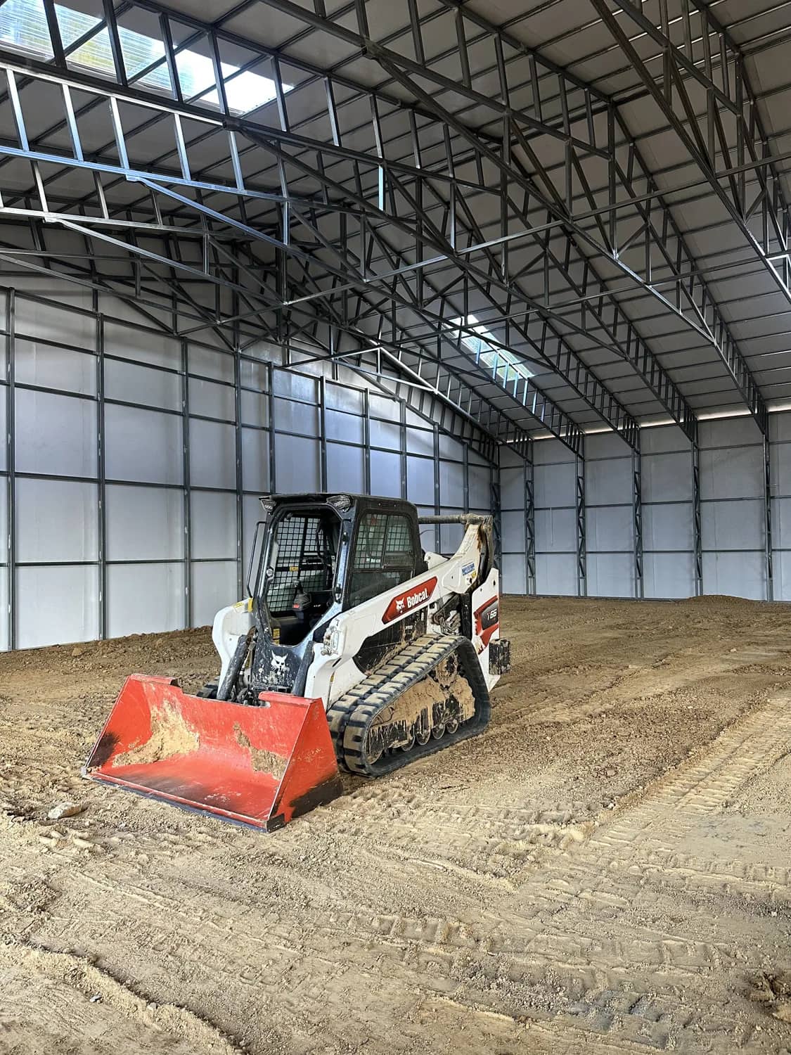 Compact track loader on a prepared property